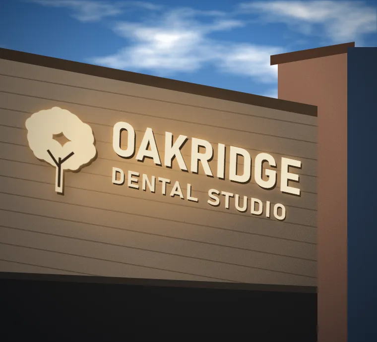 Illuminated dimensional letters mounted on a stone building facade
