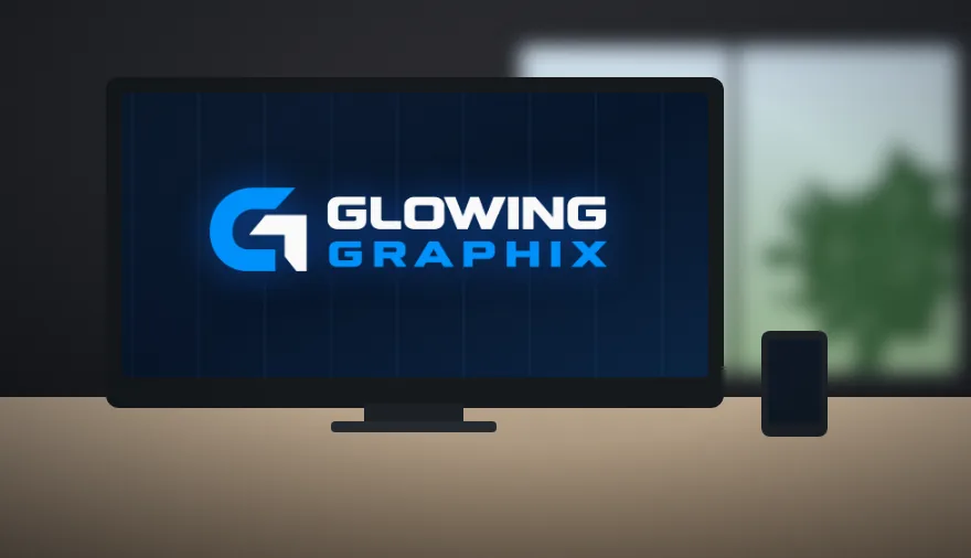 Design workstation showing the Glowing Graphix logo on screen